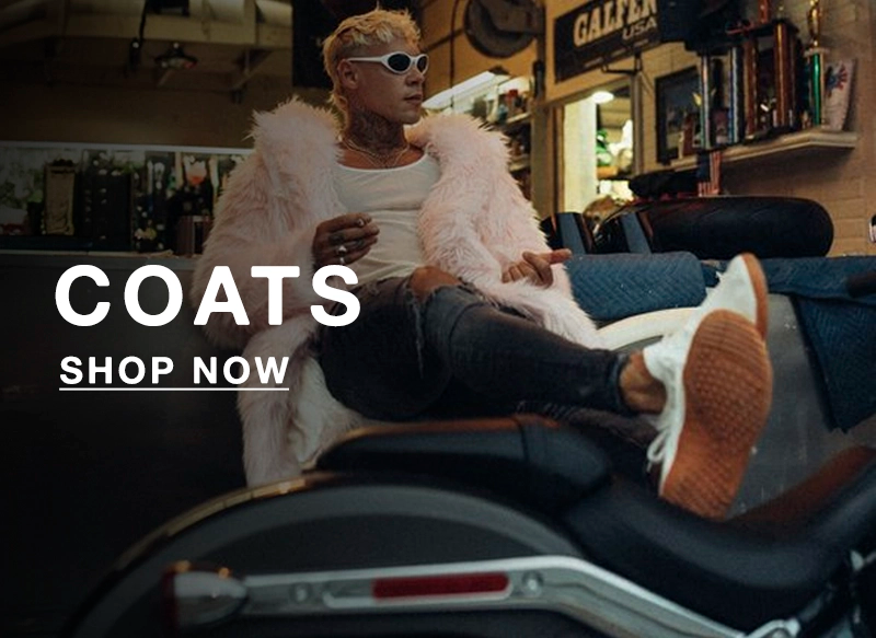 Person sitting on a motorcycle wearing a white coat with text 'COATS SHOP NOW' in a casual setting.