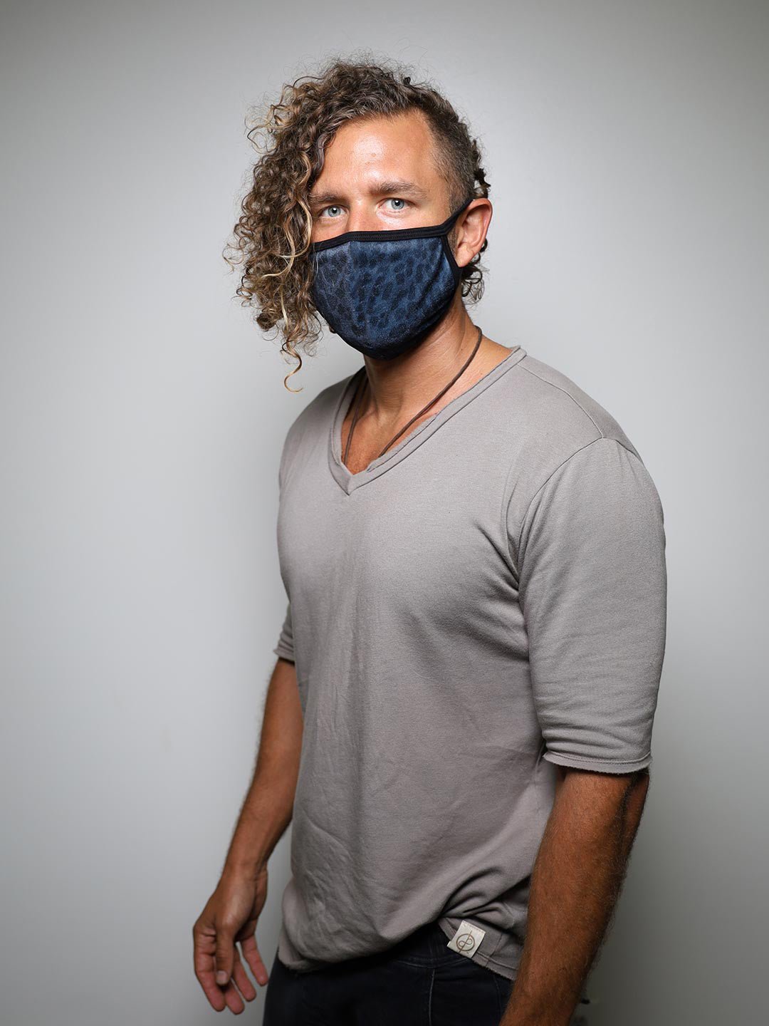 Man wearing Black Panther Cloth Face Mask, side view