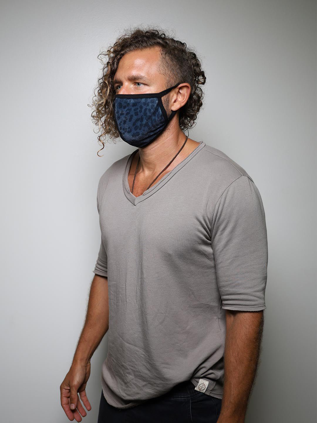 Man wearing Black Panther Cloth Face Mask, side view 2