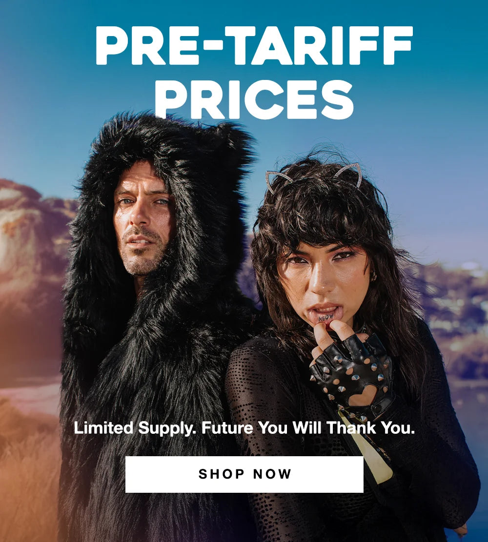 Two models pose outdoors in edgy faux fur fashion against a scenic desert-like background. The man wears a black furry hooded garment with bear-like ears, while the woman wears studded gloves, a sheer black outfit, and sparkly cat ear headband, lifting her lip to reveal a tattoo that says "MEOW." Bold text reads “PRE-TARIFF PRICES – Limited Supply. Future You Will Thank You.” with a “SHOP NOW” button underneath.