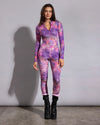 Lightweight tie-dye leopard print rave bodysuit paired with black combat platform boots for festival fashion.