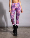 Purple and pink leopard print mesh leggings by SpiritHoods, designed for breathable rave wear and active dancing.