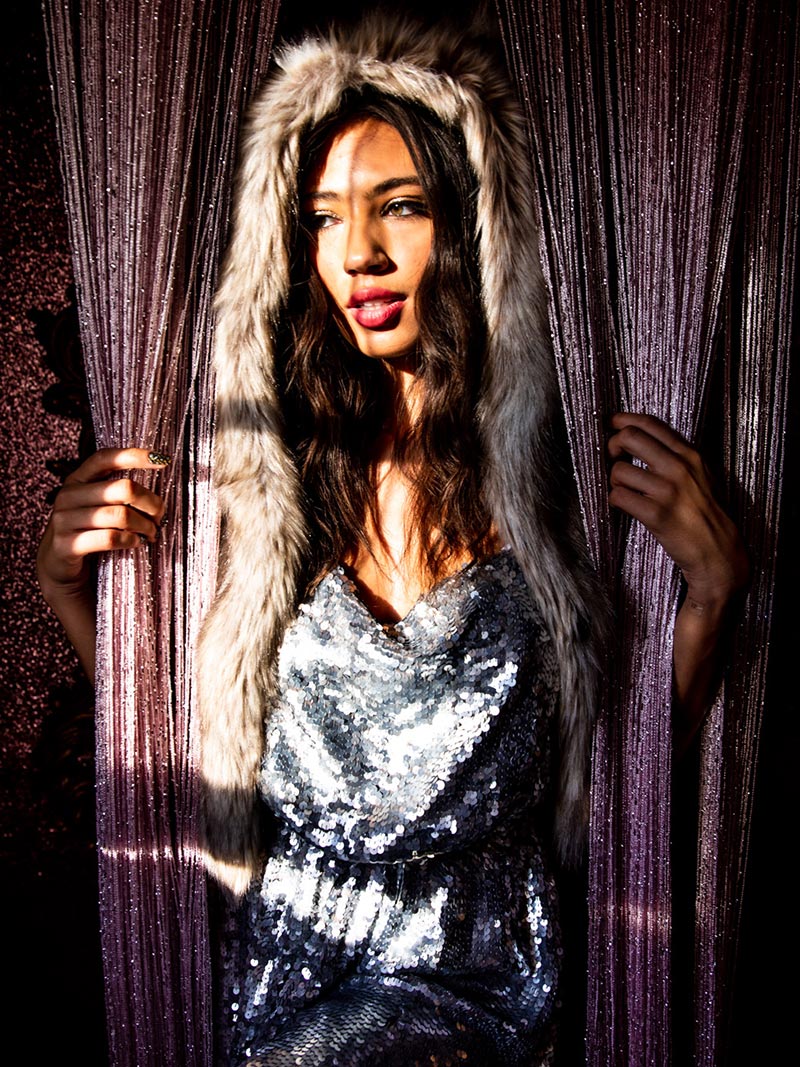 Woman wearing faux fur Collector Edition Timber Wolf Shawl, front view