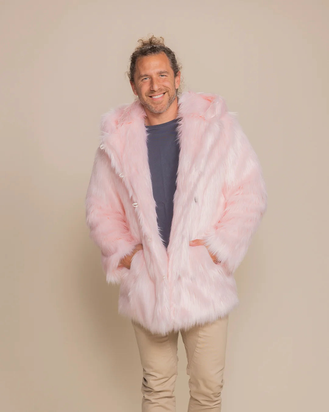 Men's Flamingo Wolf pink faux fur coat featuring an oversized hood and a relaxed, unisex silhouette.