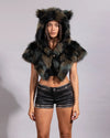Earth-tone camouflage faux fur festival gear for women, featuring a plush, oversized hood with pointed feline ears.