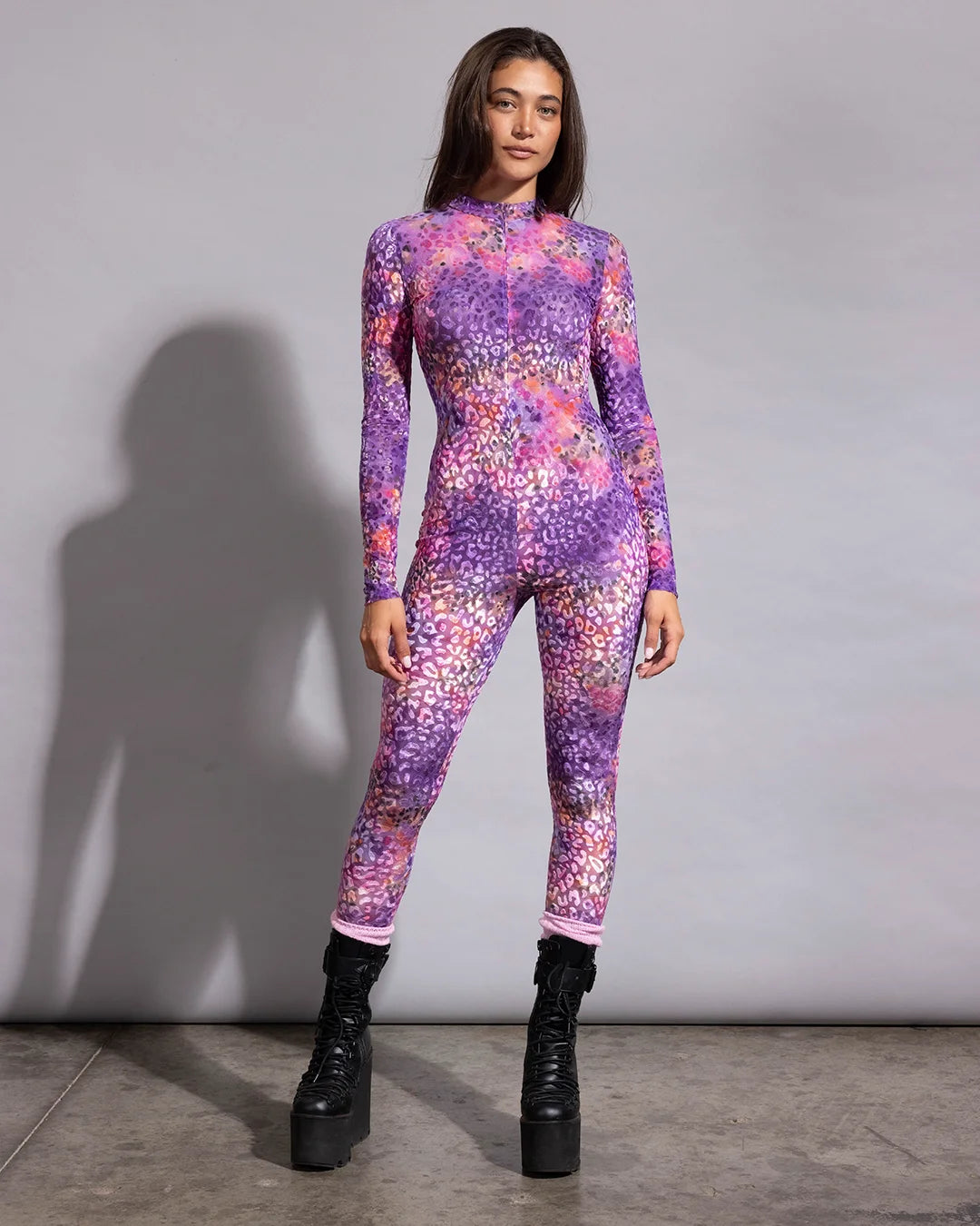 Sheer purple and pink leopard print mesh catsuit designed as a breathable, form-fitting festival layer.