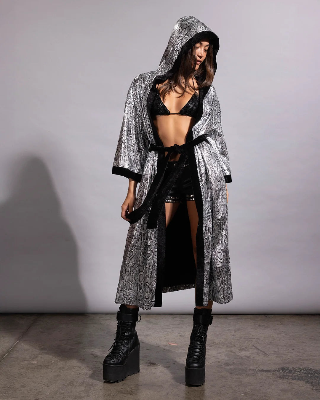 Lightweight silver sequin hooded kimono paired with black rave boots for the ultimate festival fashion look.