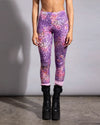 Lightweight tie-dye leopard rave leggings styled with pink socks and black platform combat boots for a festival look.