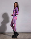 Top-rated festival fashion: a women's sheer full bodysuit showcasing a colorful animal print pattern.