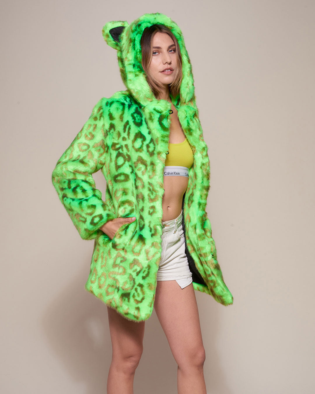 Woman wearing Neon Green Leopard Luxe Classic Faux Fur Coat, side view 2