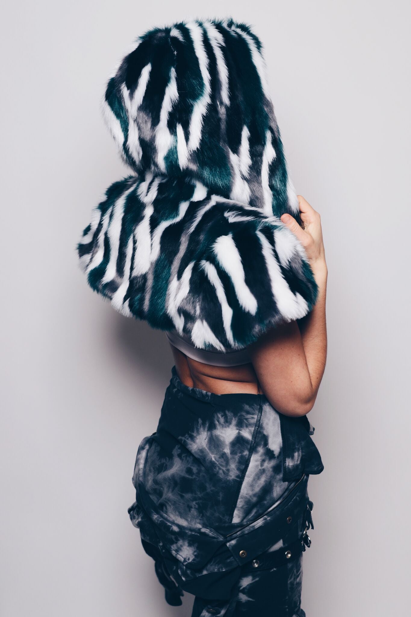 Woman wearing Faux Fur Limited Edition Lapwing Shawl 2.0 SpiritHood, side view 1