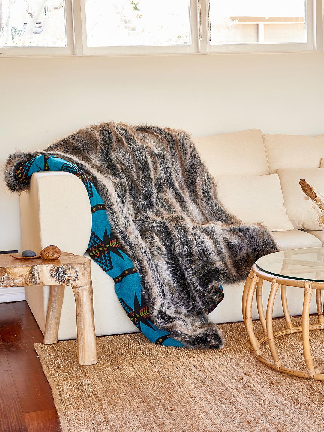 Exterior and Liner View of Grey Wolf Faux Fur Throw on Couch