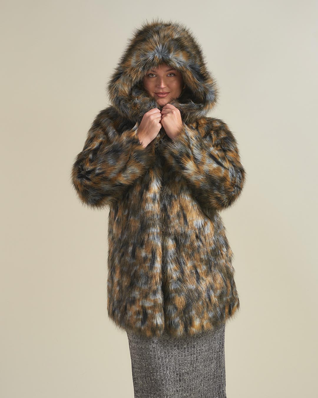 Woman Wearing Brindle Wolf Hooded Faux Fur Coat 