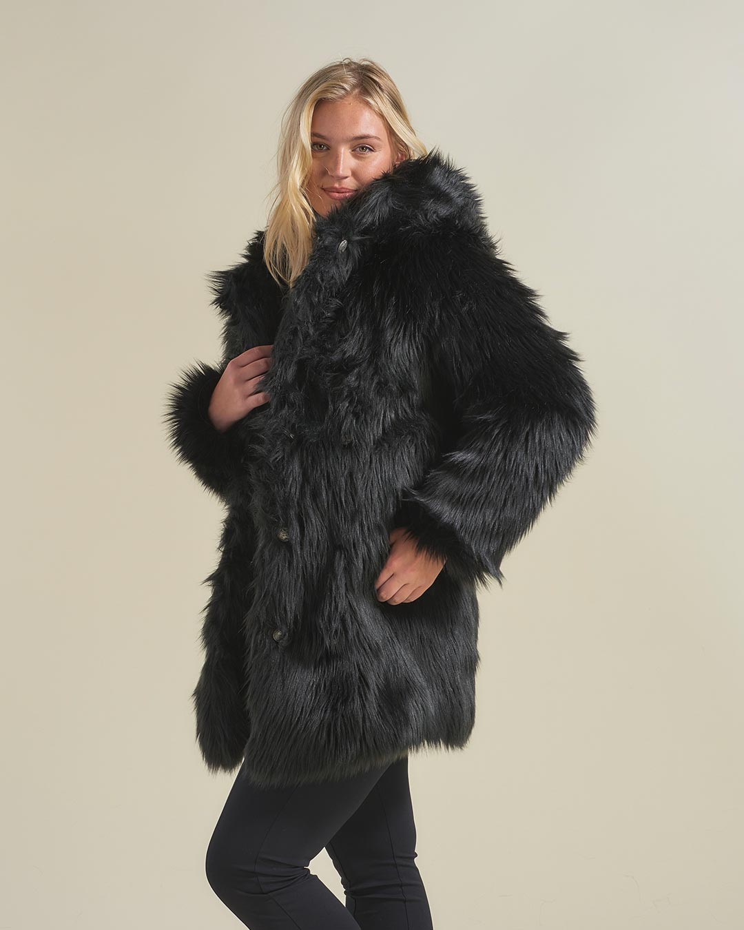 Blonde Woman Wearing Black Wolf Hooded Faux Fur Coat Without Hood