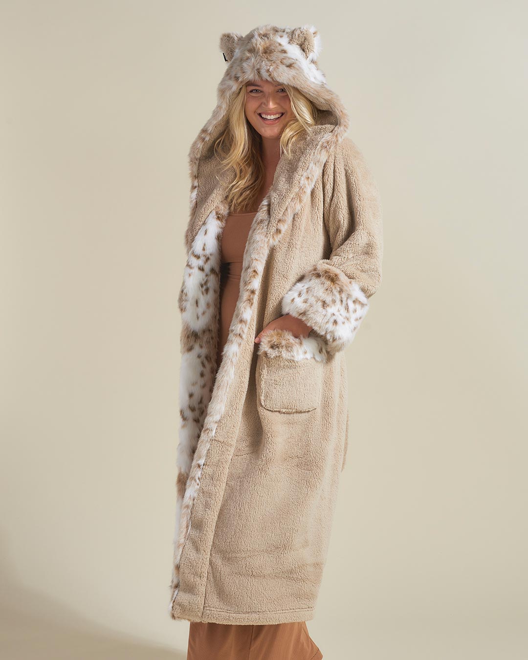 Woman wearing Snow Leopard Classic Faux Fur Robe, front view 7