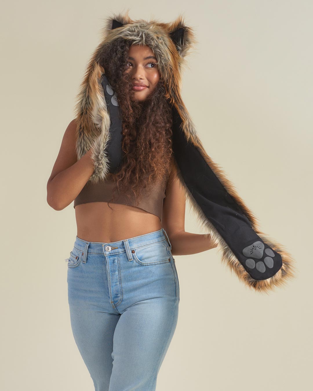 Woman Showing Signature Paw Logo on Black Linen Liner of Red Fox Hooded Faux Fur