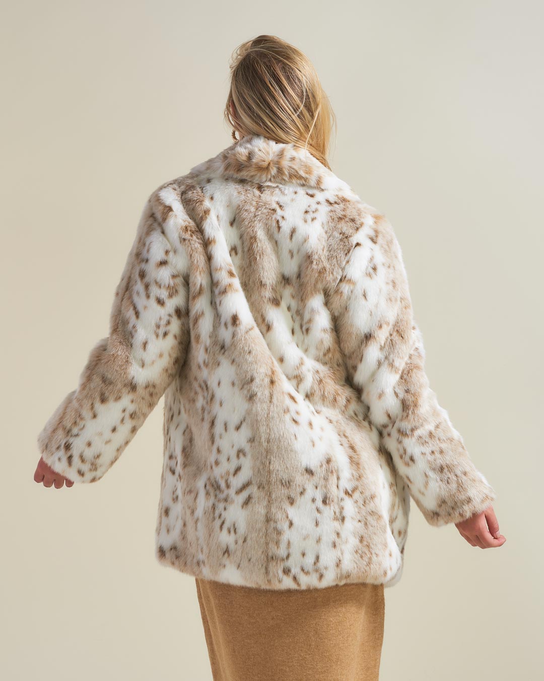 Back View of Siberian Snow Leopard Collared Faux Fur Coat on Blonde Model