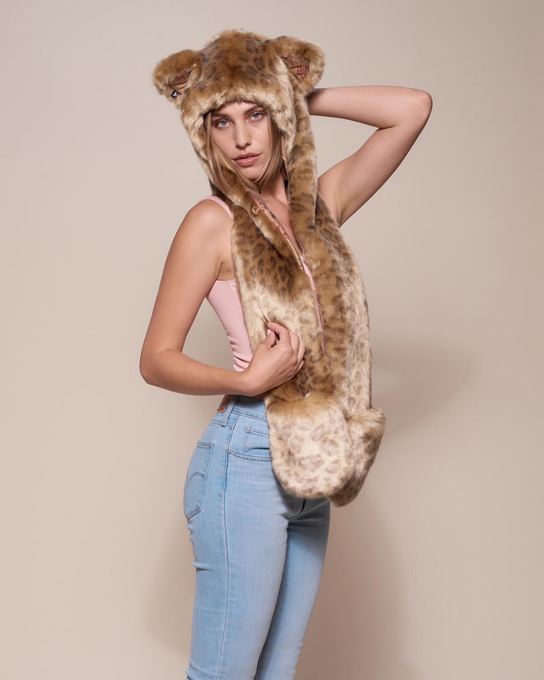 Woman wearing African Golden Cat Luxe Faux Fur Collector Edition Hood, side view 3