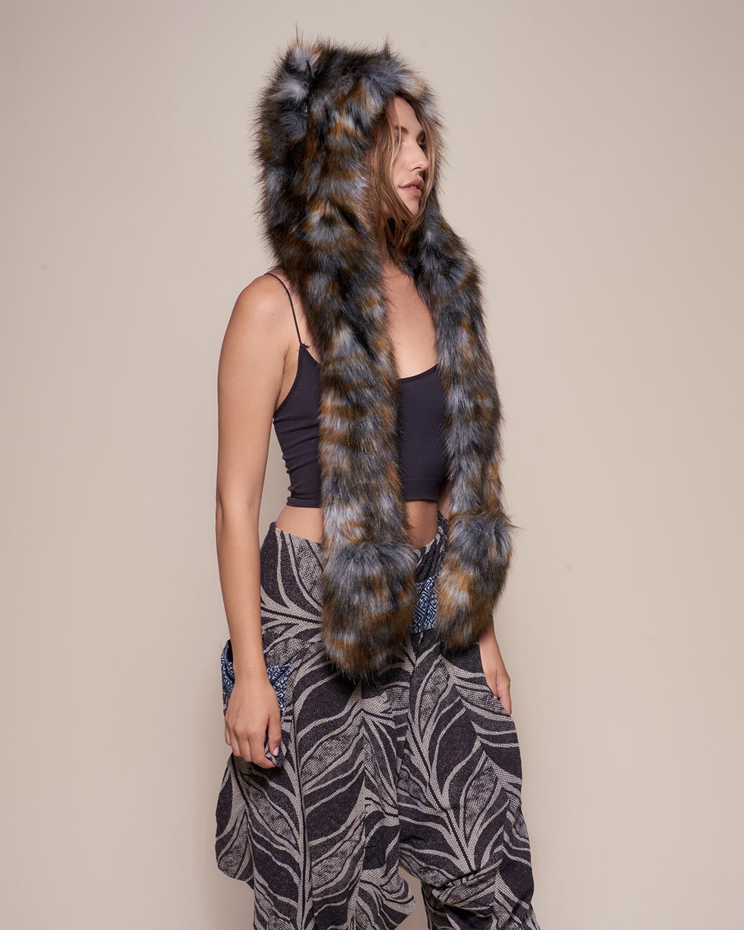 Woman wearing Brindle Wolf Collector Edition Faux Fur Hood, side view 3