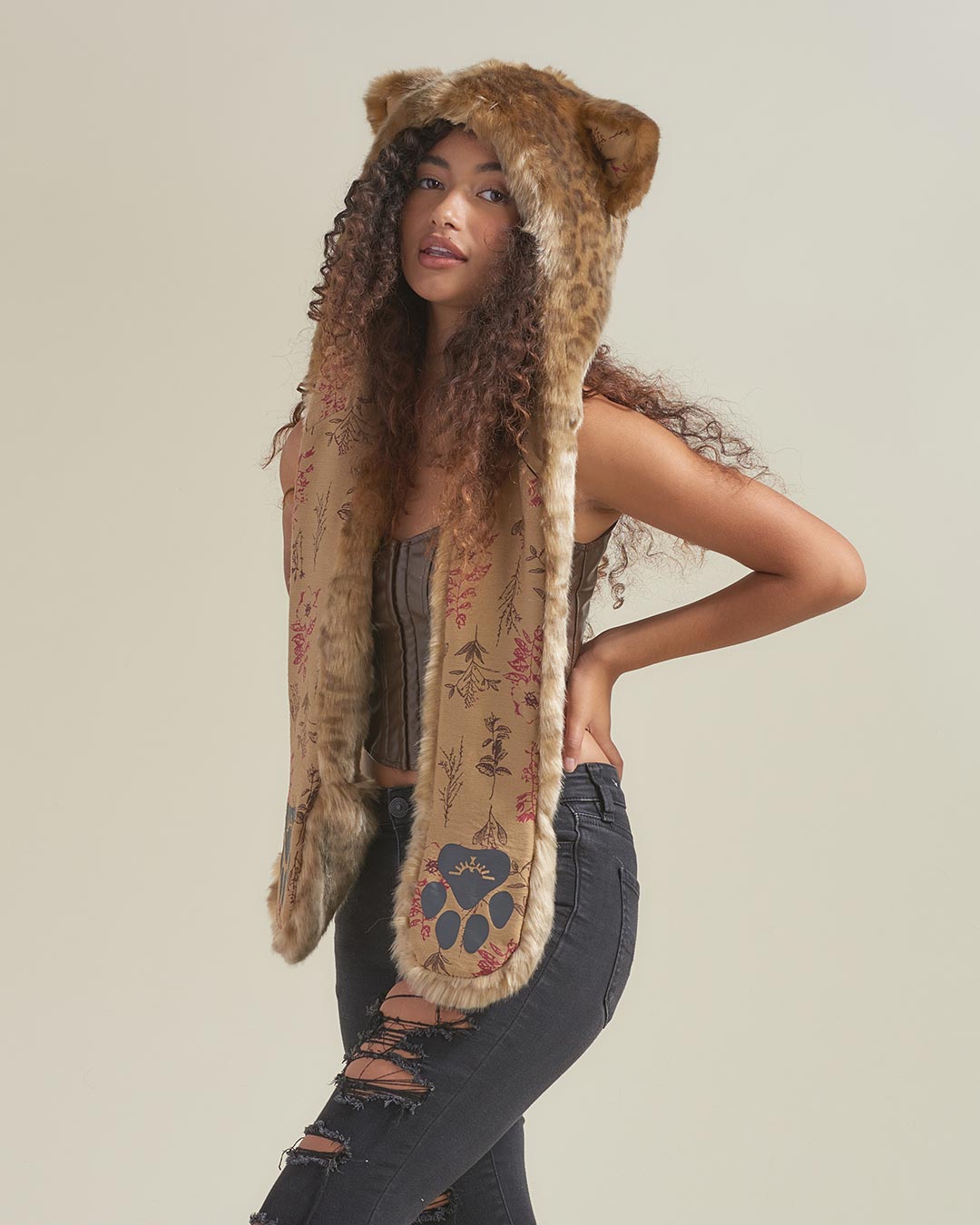 Woman wearing African Golden Cat Luxe Faux Fur Collector Edition Hood, side view 2