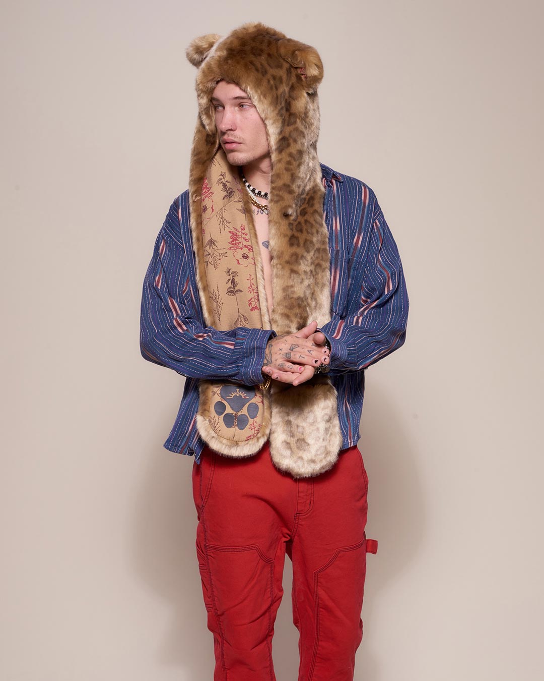 Man wearing African Golden Cat Luxe Faux Fur Collector Edition Hood, front view 3