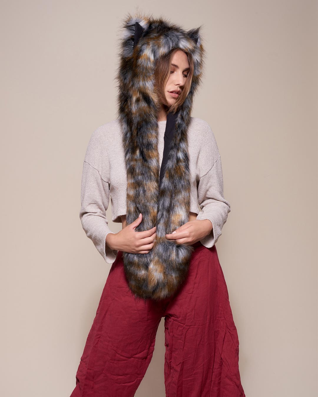 Woman wearing Brindle Wolf Collector Edition Faux Fur Hood, side view 1