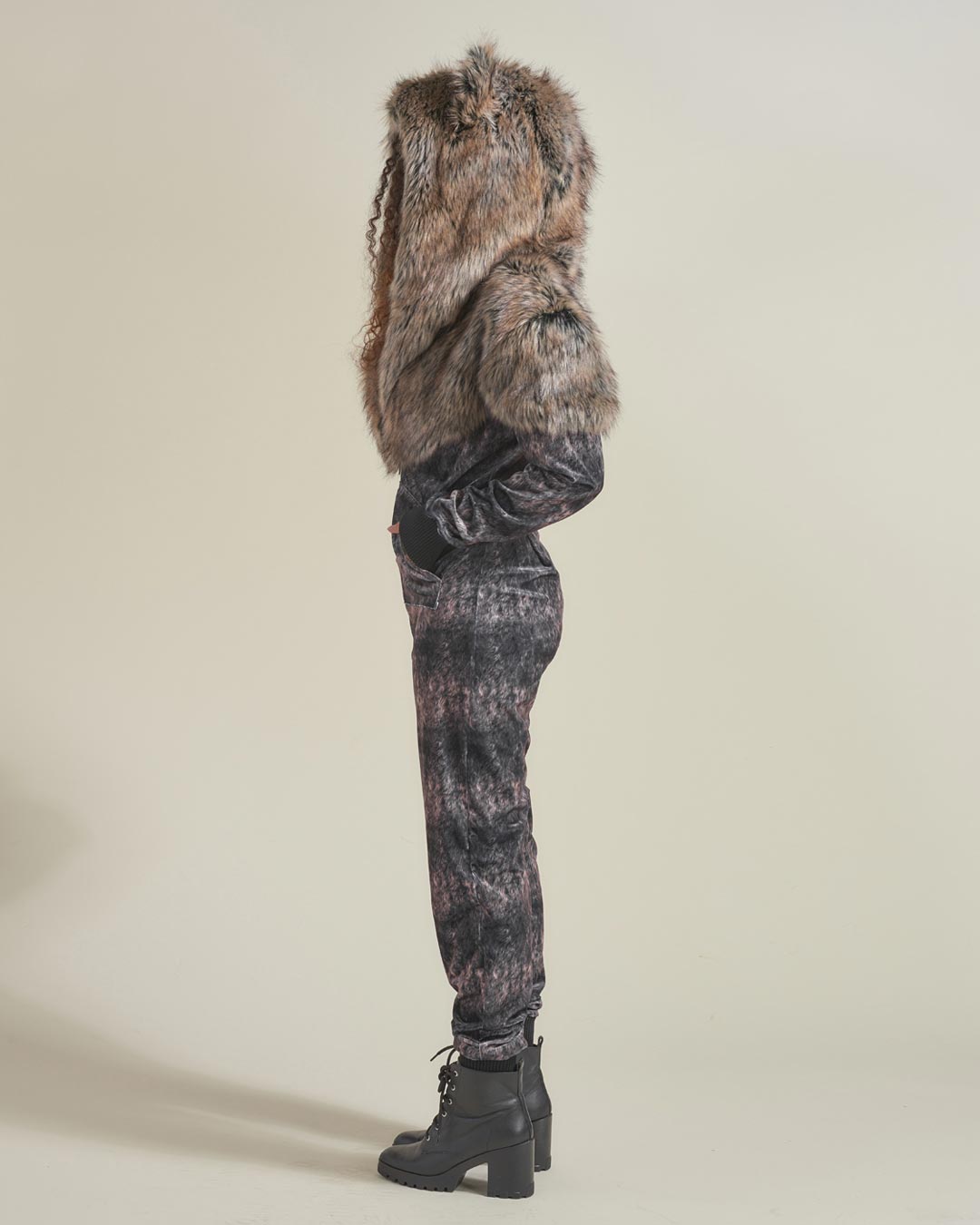 Woman wearing Grazer Wolf Artist Edition Faux Fur Animal Onesie, side view