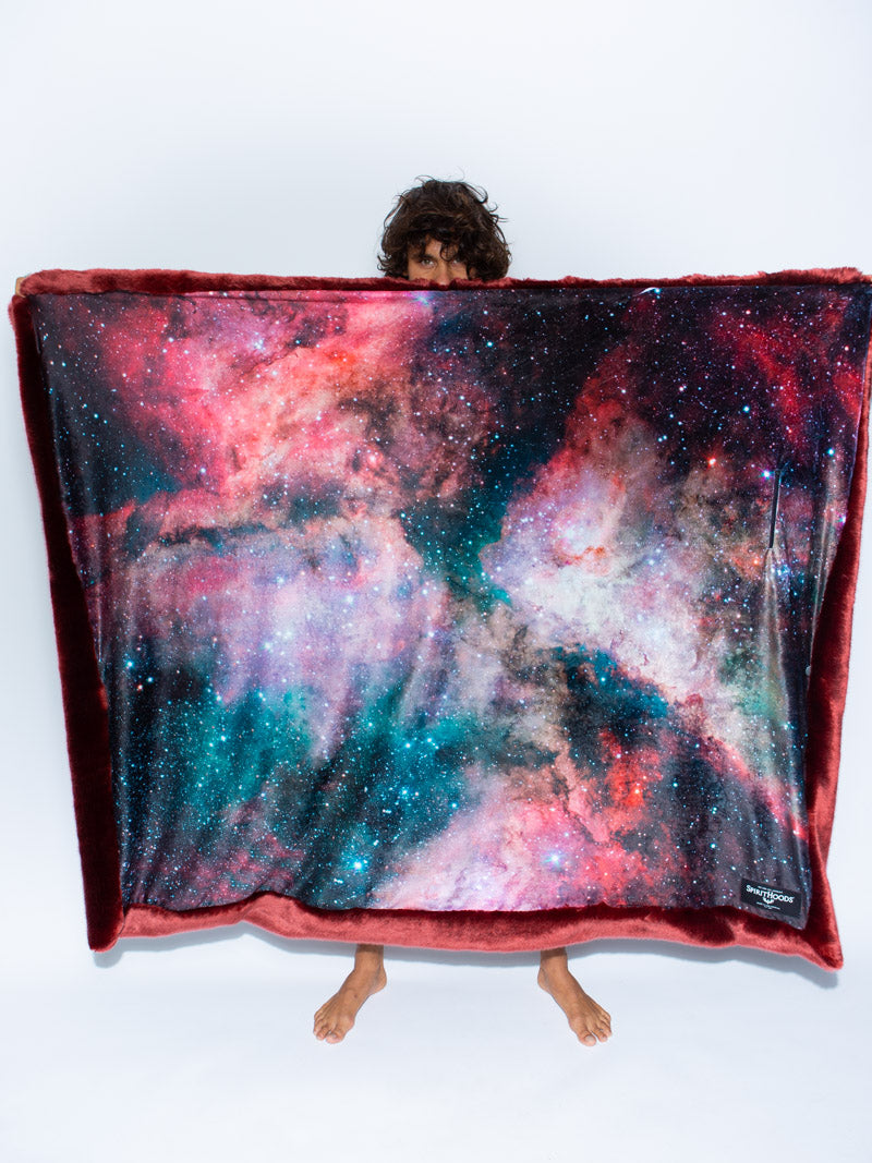 Male Model Holding Faux Fur Collector Edition Dragon Wolf Galaxy Throw