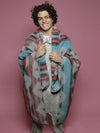 Man Wearing Coral Adventure Fabric Throw