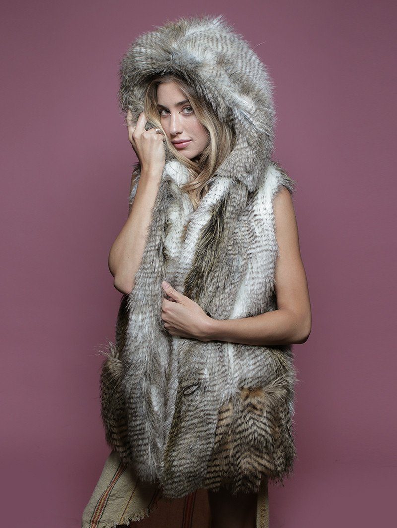 Woman wearing Alaskan Hawk Hooded Faux Fur Vest, side view 1