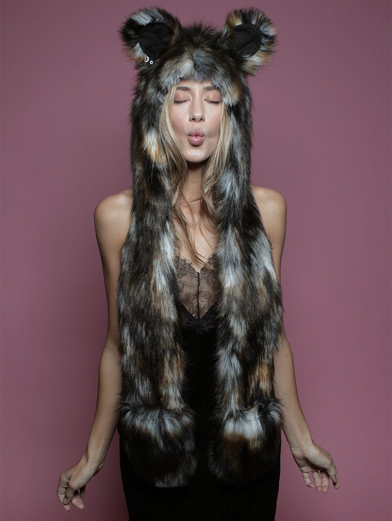 Woman wearing faux fur African Wild Dog Collector SpiritHood, front view 1