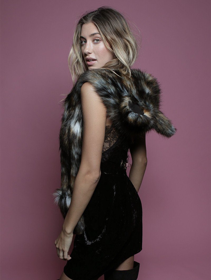 Woman wearing faux fur African Wild Dog Collector SpiritHood, side view 1