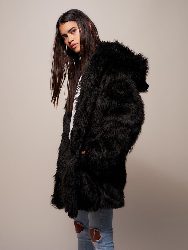 Woman wearing Black Wolf Galaxy Faux Fur Coat, side view