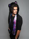 Man wearing faux fur Black Wolf Purple Haze Collector SpiritHood, side view 1