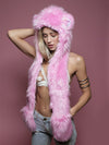 Woman wearing faux fur Cheer Bear Collector Edition SpiritHood, side view