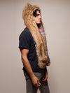 Man wearing faux fur Limited Edition Coyote SpiritHood, side view 1