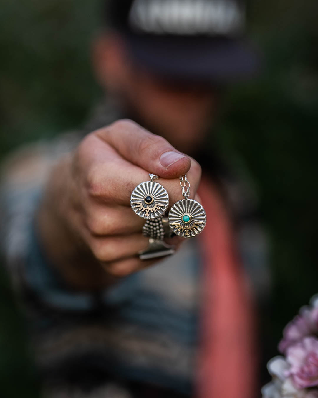 Close Up of Model Holding Phoenix Sterling Silver Collector Edition Pendant 