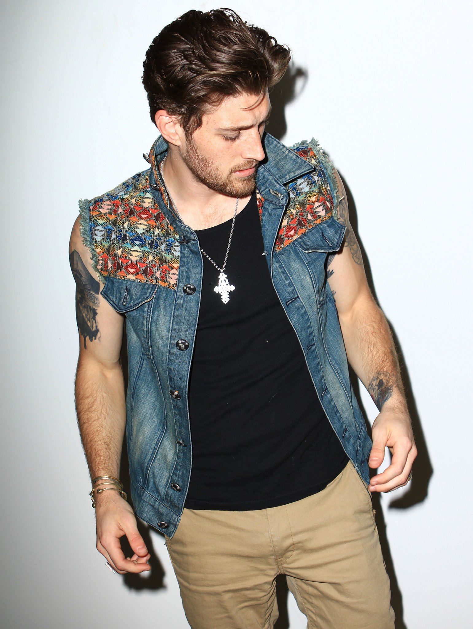Man wearing SpiritHoods Denim Vest, front view 1
