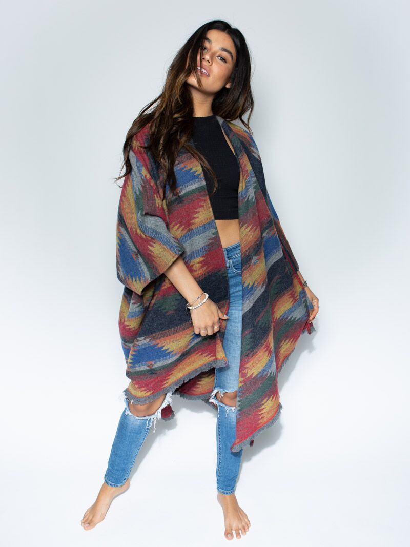 Woman wearing Dire Wolf Fabric Poncho, front view 4