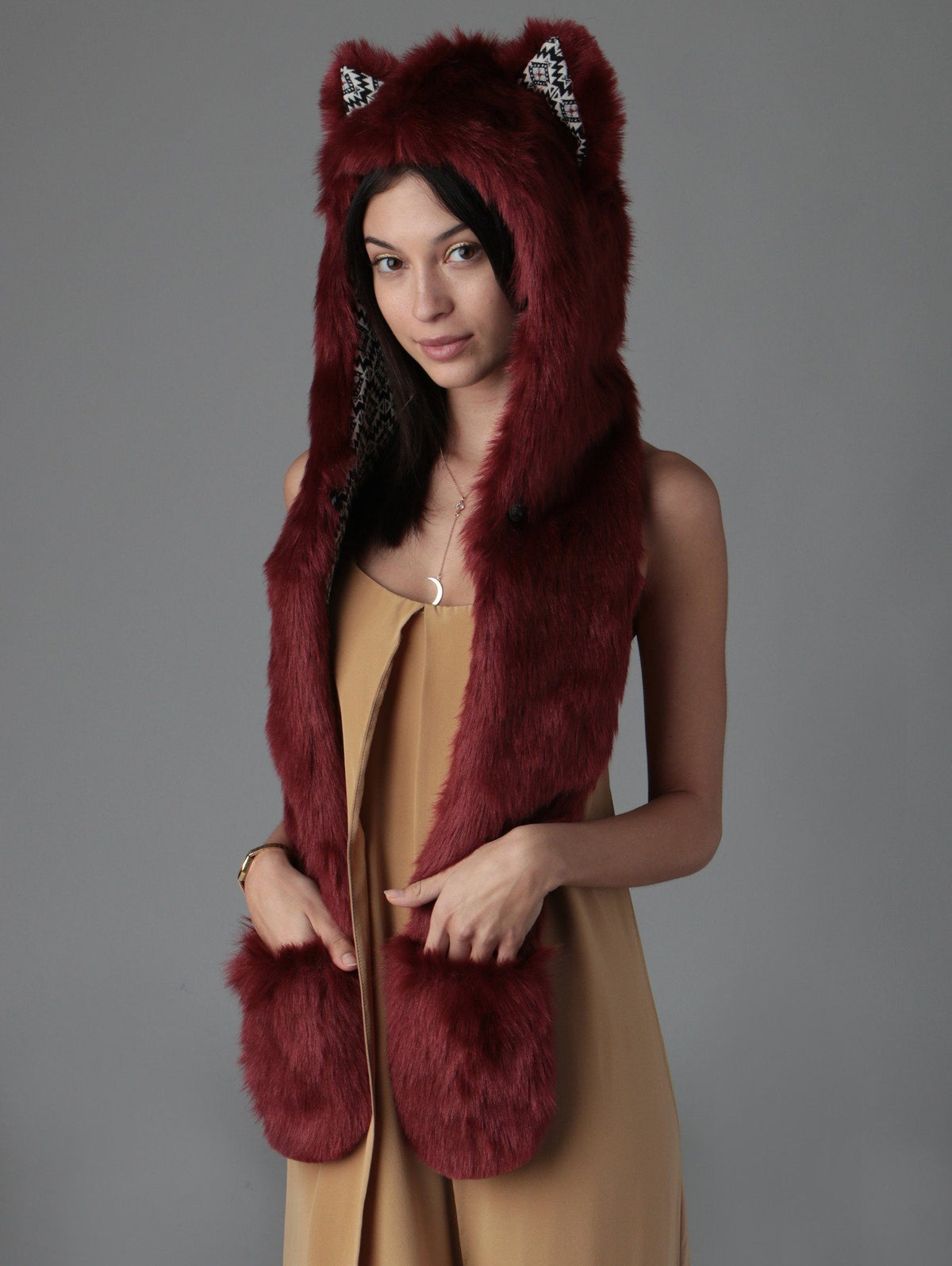 Woman wearing faux fur Fire Wolf CE SpiritHood, side view