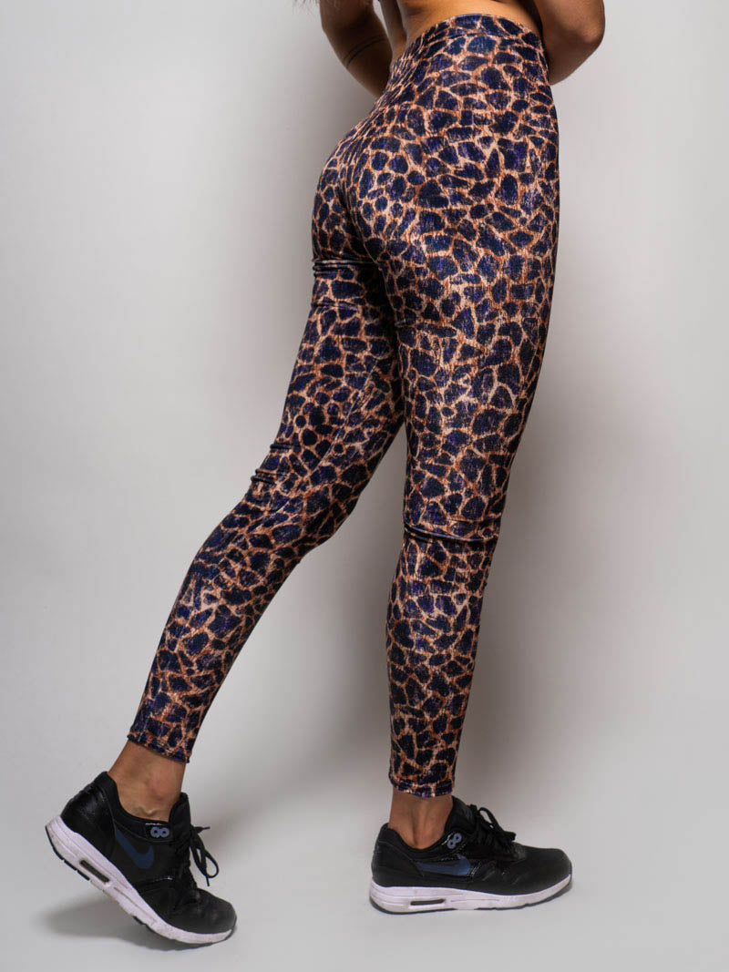 Woman Wearing Velvet Leggings in Purple Cheetah