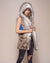 Woman wearing Alaskan Hawk Hooded Faux Fur Vest, side view 2