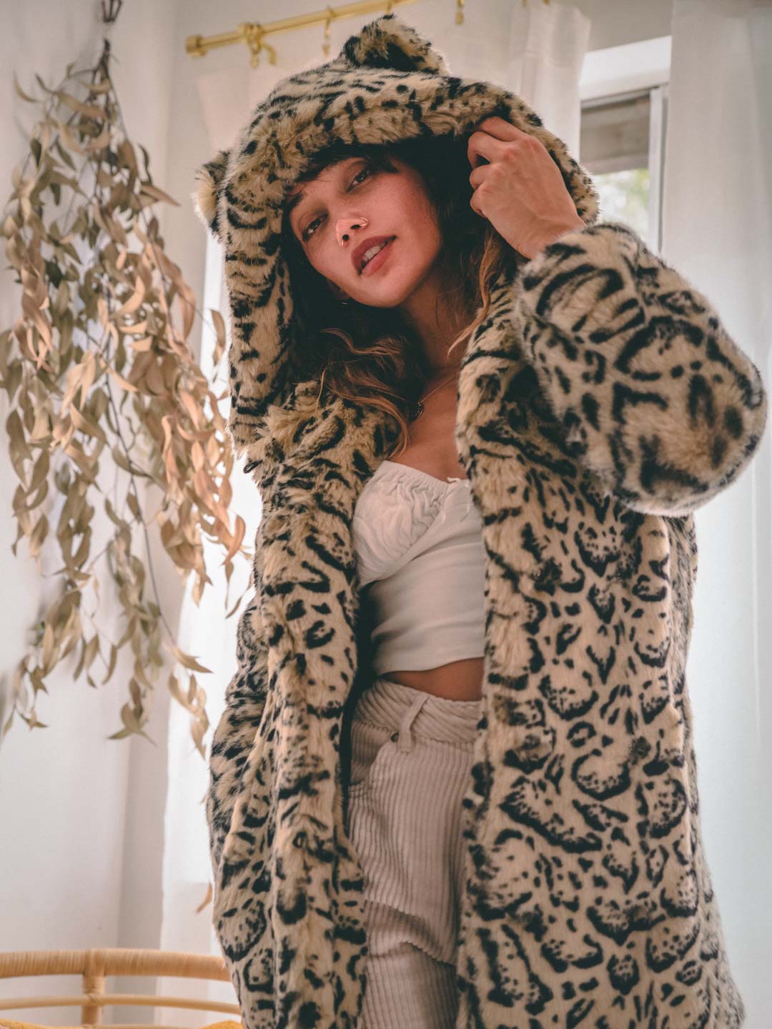 Woman wearing Classic Ocelot Luxe Faux Fur SpiritHood Coat, front view