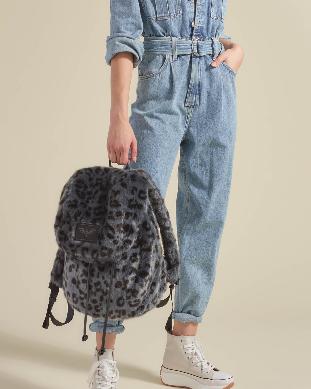 Woman Holding Slate Leopard Faux Fur Backpack