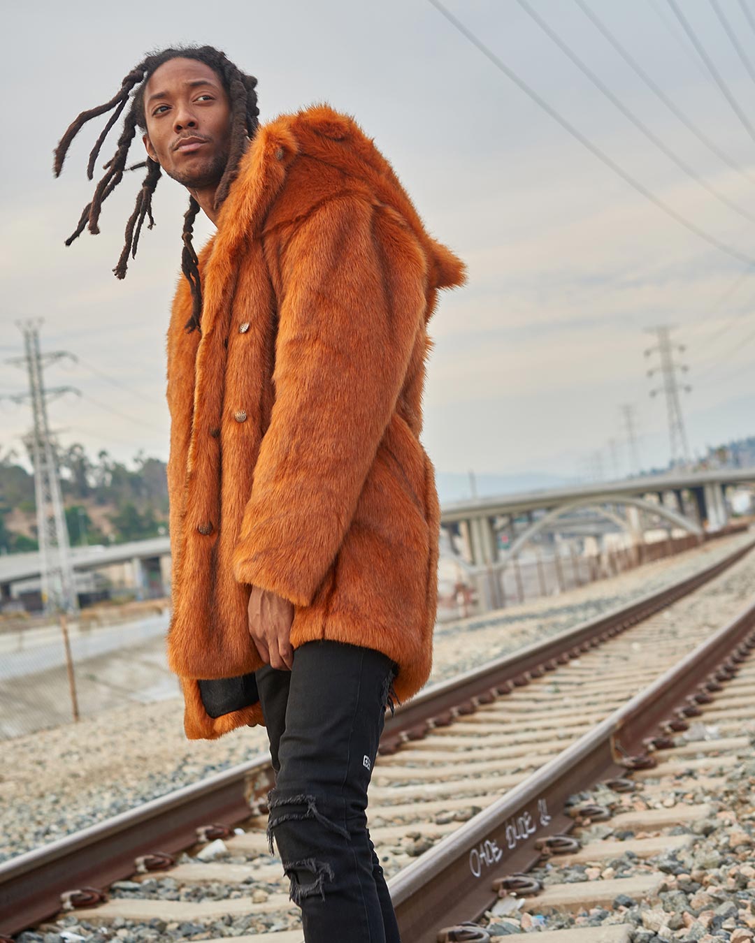 Man wearing Artist Edition VAMP Wolf Faux Fur Coat, side view 1