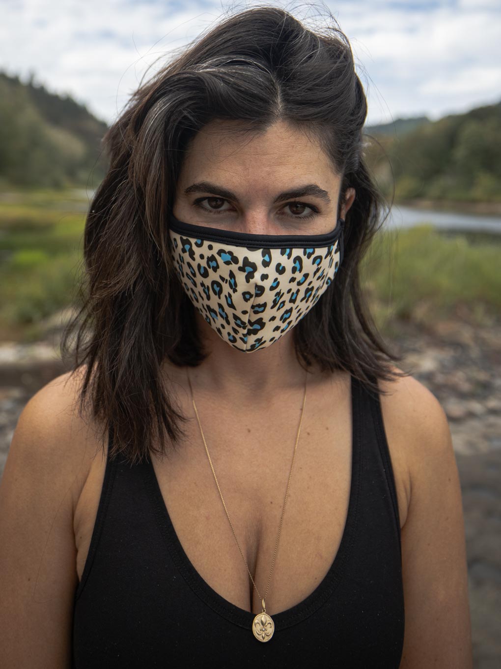 Woman wearing Blue Spotted Leopard Copper-Threaded Face Mask, front view