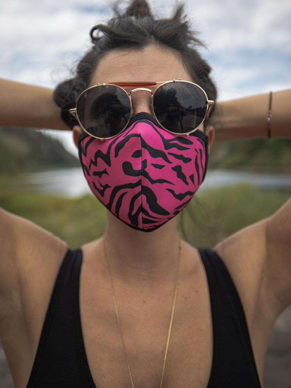 Neon Pink Zebra Copper-Threaded Face Mask on Woman