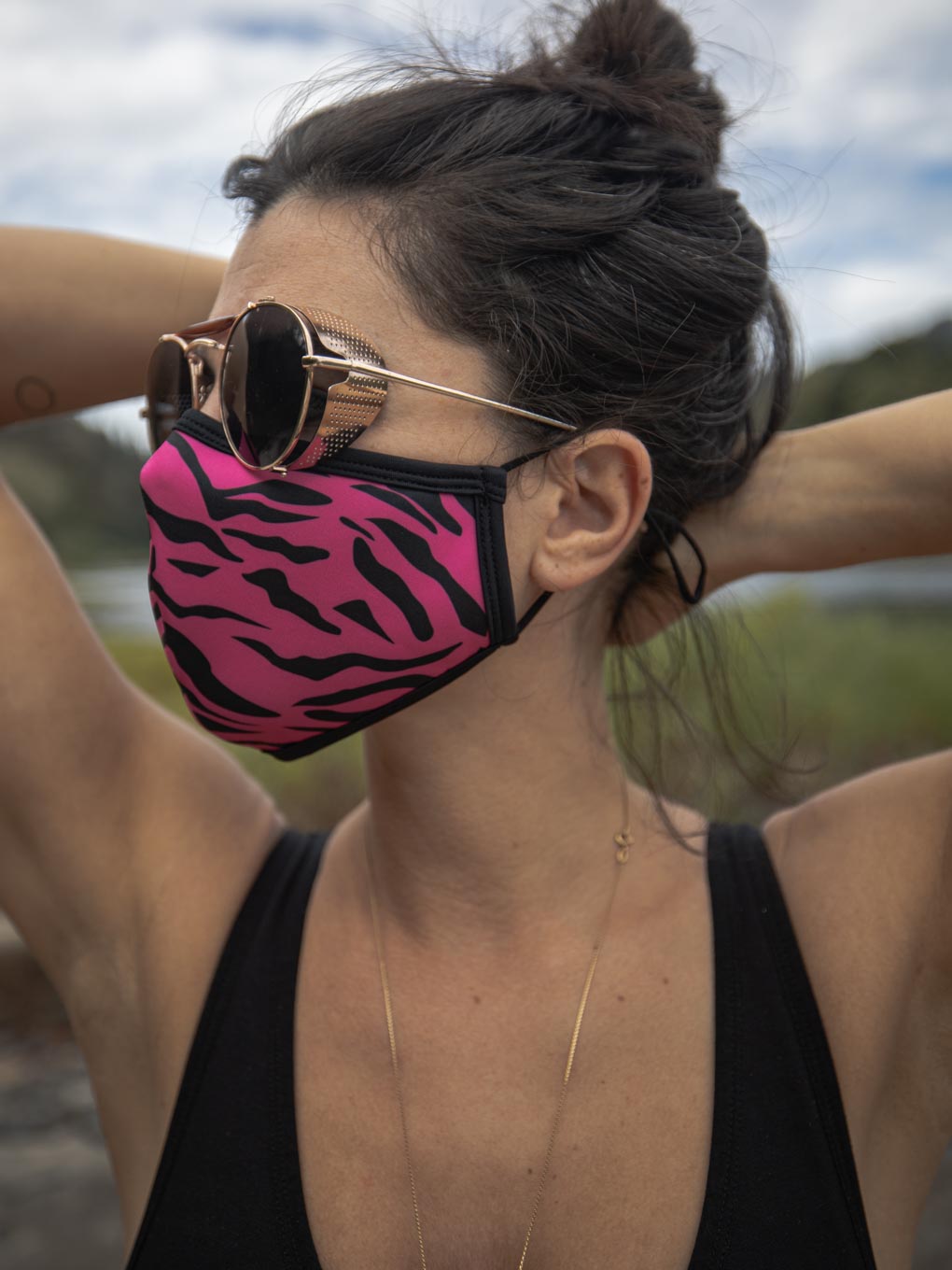 Woman Wearing Neon Pink Zebra Copper-Threaded Face Mask