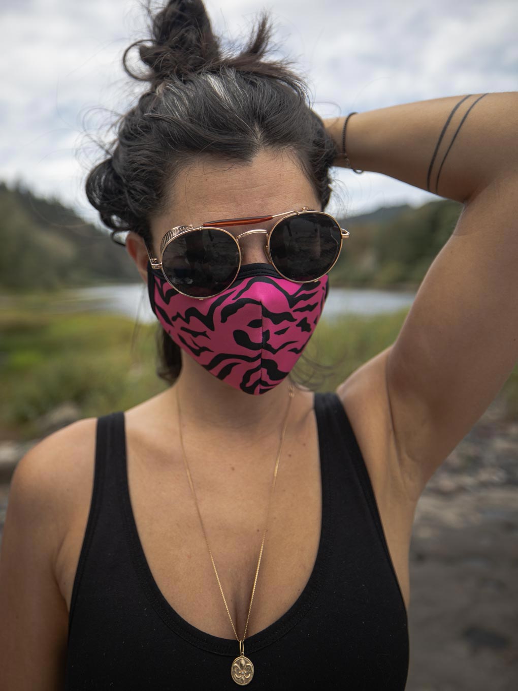 Front View of Neon Pink Zebra Copper-Threaded Face Mask on Woman