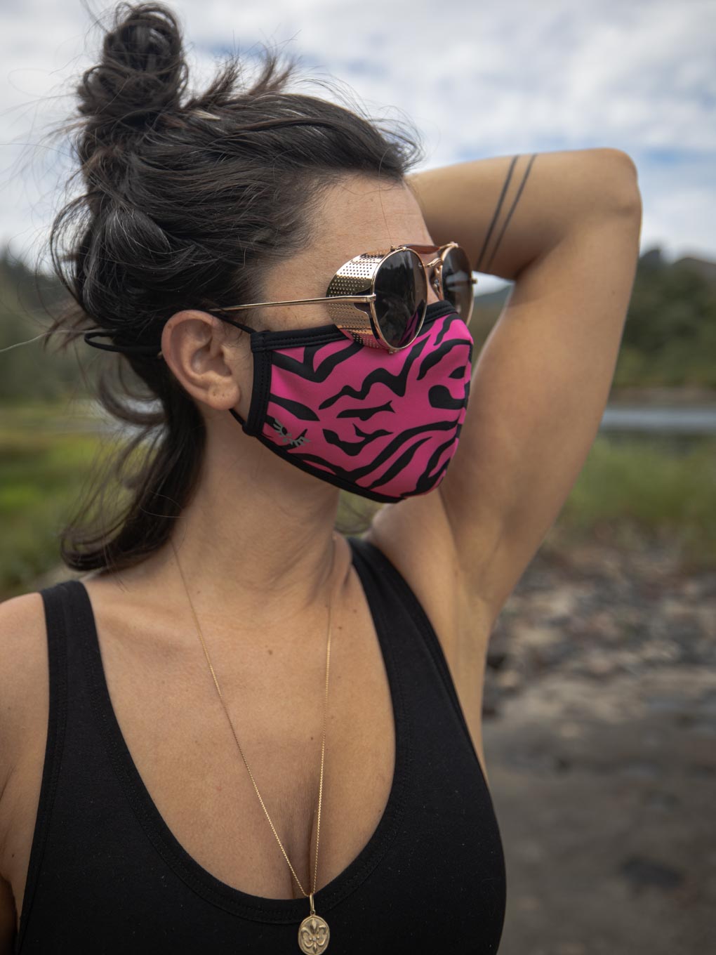Side View of Neon Pink Zebra Copper-Threaded Face Mask on Woman